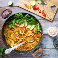 A Thai dish garnished with lemongrass and fresh herbs.