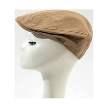 A soft beret with its crown folded loosely to one side.