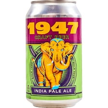 A pint of India pale ale beside a craft beer can.