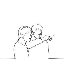 A person pointing toward a particular object.
