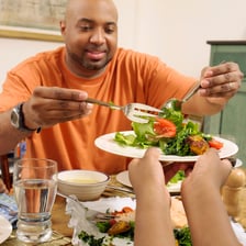 A person eating a substantial meal