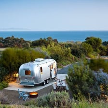 An Airstream trailer being used on a road trip.
