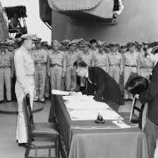 Officials signing a document that transfers control or territory