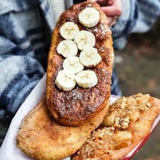 A flat, elongated fried pastry known as a Canadian BeaverTail