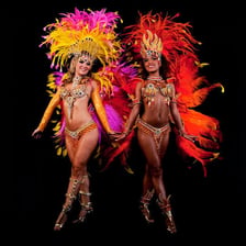 Dancers performing samba in colorful Brazilian carnival attire.