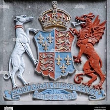 A coat of arms bearing a traditional Latin motto.