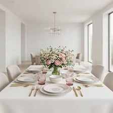 A formal dining table set with fine china