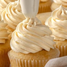 A richly frosted dessert representing an excessively sweet taste