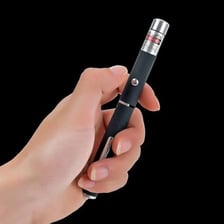 A pen-shaped laser pointer projecting a red dot.