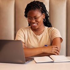 A college student viewing an email account on a laptop.