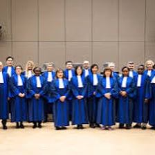 Judges seated in a tribunal courtroom