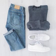 A collection of casual clothing arranged as an outfit.