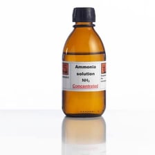 A laboratory container labeled ammonia