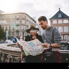 An inexperienced traveler studying a city map