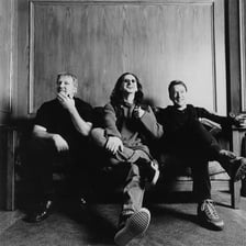 The three members of the rock band Rush performing together