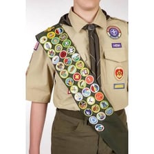A scouting sash covered with merit badges