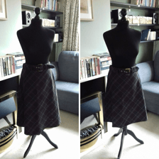 A skirt being folded and sewn to create a shorter hemline.