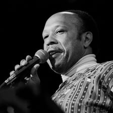 Les McCann performing at a piano