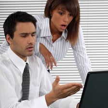 A person discreetly helping an accomplice during a criminal act.