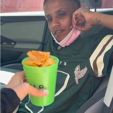 A person eating a small snack