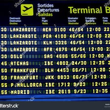 An airport arrivals board displaying estimated arrival times.