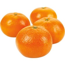 An orange beside a smaller clementine