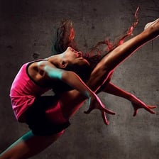 A dancer performing a defined dance step