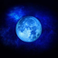 A full moon appearing blue-tinted in the night sky.