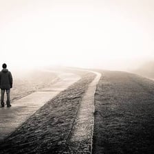 A person gazing into the distance with a longing expression.