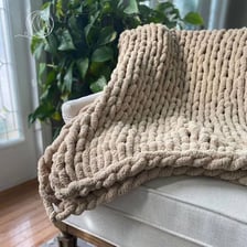 A colorful hand-crocheted afghan blanket.