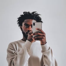 A person taking a selfie with a smartphone