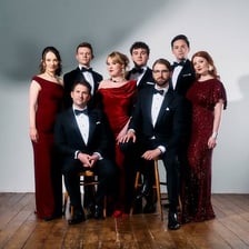 An eight-member a cappella vocal ensemble performing