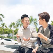 Two friends talking together outdoors