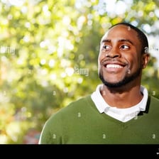 A smiling person looking pleased