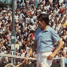 Ilie Năstase competing in a tennis match