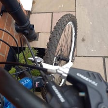 Close-up of taut cables on a bicycle.