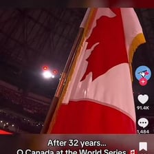 A Canadian flag at a performance of the national anthem