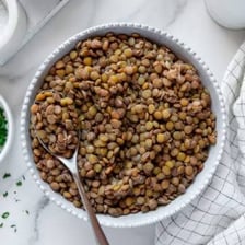 Several varieties of lentils displayed in a bowl.