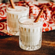 Glasses of creamy eggnog served as a winter holiday drink.