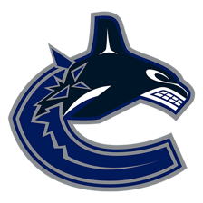 Vancouver Canucks players in hockey uniforms during a game