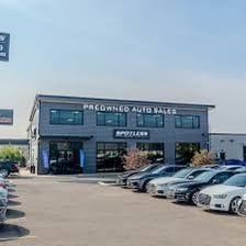 Previously owned vehicles displayed at a car dealership