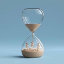 An hourglass nearly empty as its remaining sand runs out.