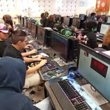 A group of students working with computers and technical equipment
