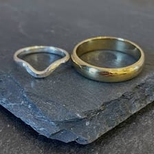 Two wedding rings representing two simultaneous marriages.