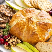 A round of Brie cheese baked inside golden puff pastry