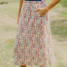 A person wearing a calf-length midi skirt.