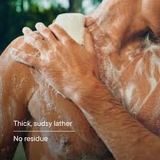 A bar of soap covered in white suds.