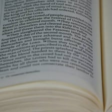 An open book with its pages clearly visible.