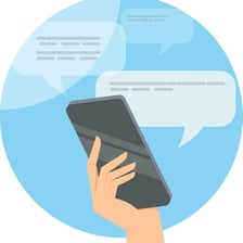 A person sending a short message from a smartphone.