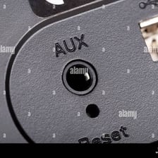 A close-up of an audio input port on a speaker.